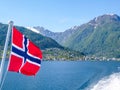 Norway - Norwegian flag waving above the water. Royalty Free Stock Photo