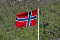 The Norwegian flag hoisted on a post Royalty Free Stock Photo