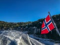 Norwegian Flag Sailing From Back of Ferry in Oslo Fjord