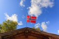 The norwegian flag against blue sky Royalty Free Stock Photo