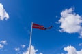 Norwegian flag waving on blue sky and white clouds Royalty Free Stock Photo