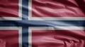 Norwegian flag waving in the wind. Close up of Norway banner blowing soft silk Royalty Free Stock Photo