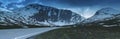 Norwegian highway road in the mountains covered with snow Royalty Free Stock Photo