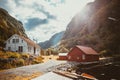 Norwegian houses in a fjord against the sun Royalty Free Stock Photo