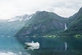 Norwegian landscape with a boat in the fjord Royalty Free Stock Photo