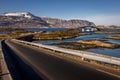 Long road between islands with bridge under witch goes a boat Royalty Free Stock Photo