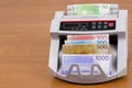Norwegian money - Krone in a counting machine