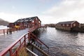 Norwegian old city A with reflections in water and cloudy sky, n Royalty Free Stock Photo