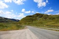 Road green mountains landscape hills blue sky summer Norway travel empty highway nature asphalt mountain hill rural way beautiful Royalty Free Stock Photo