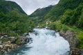 Norwegian rural landscape with fast mountain river Royalty Free Stock Photo