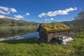 A Norwegian scenic, a fisherman`s hut with a boat parked in it. Norway, Sogn & Fjordane county Royalty Free Stock Photo