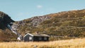 Norwegian traditional black house on serpentine mountain road