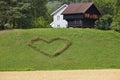 Norwegian traditional farm house and heart symbol in the country Royalty Free Stock Photo