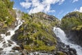 Norwegian twin waterfall. Rocky forest landscape. Latefossen. Vi