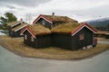 The Norwegian typical grass roof country house, classic wooden cottage in Norway, countryside.