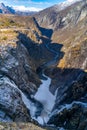 Norwegian Voringfossen waterfall in early spring, leftover ice left over from winter in the Bjoreio valley in the Eidfjord Royalty Free Stock Photo