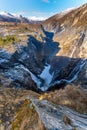 Norwegian Voringfossen waterfall in early spring, leftover ice left over from winter in the Mabodalen valley in the Eidfjord Royalty Free Stock Photo