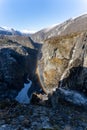 Norwegian Voringfossen waterfall in early spring, leftover ice left over from winter in the Mabodalen valley in the Eidfjord Royalty Free Stock Photo