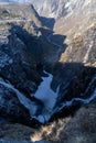 Norwegian Voringfossen waterfall in early spring, leftover ice left over from winter in the Mabodalen valley in the Eidfjord Royalty Free Stock Photo