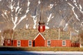 Norwegian wooden red church before mountain Royalty Free Stock Photo