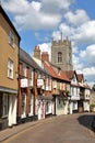 NORWICH, UK - JUNE 3, 2017: Colorful medieval facades at Princes Street with St George Tombland church in the background and a bea