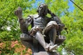 NORWICH, UK - JUNE 4, 2017: The statue of Sir Thomas Browne by sculptor Henry Alfred Pegram with a colorful background
