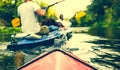 Nose of canoe floating behind rower