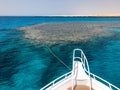 The nose, the front of the white yacht, the boat, the ship standing on the jig, parking, anchoring in the sea, the ocean with blue Royalty Free Stock Photo