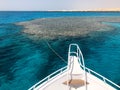 The nose, the front of the white yacht, the boat, the ship standing on the jig, parking, anchoring in the sea, the ocean with blue Royalty Free Stock Photo