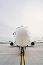 Nose of a landed civil aircraft parked on the runway Royalty Free Stock Photo