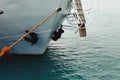 The nose of the ship is close up. Sea liner or cargo ship fixed with a rope or moored to a harbor berth