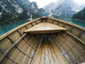 Nose of wooden boat at the alpine mountain lake. Lago di Braies, Dolomites Alps, Italy. Royalty Free Stock Photo