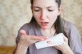 Nosebleed, a young woman with a bloody nose. Healthcare and medical concept. Close-up