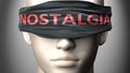 Nostalgia can make things harder to see or makes us blind to the reality - pictured as word Nostalgia on a blindfold to symbolize