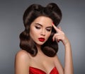 Nostalgia. Pin up girl with red lips makeup and retro curls hair Royalty Free Stock Photo