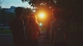 Nostalgic evening scene with three silhouetted friends walking at sunset Royalty Free Stock Photo
