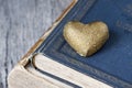 Nostalgic Golden Heart On Old Books