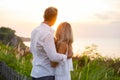 Nostalgic and romantic couple looking at sunset