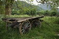 Nostalgic Serenity: Vintage Wooden Carriage Amidst Mountain Scenery Royalty Free Stock Photo