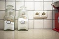 Nostalgic still life of retro kitchen with two jars salt and sugar on the counter, Selective focus on salt.