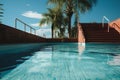 Nostalgic summer start Empty pool, rusty stairs, and tiled floor