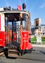 Nostalgic Taksim Tunel Red Tram, or tramvay, with Republic Monument, Statue in the background, Taksim Square, Istanbul Royalty Free Stock Photo