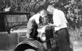 Nostalgic time: Man and Boy checking the radiator of their car