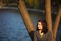 Nostalgic woman near lake