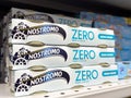 Nostromo zero tuna cans on supermarket shelf with blue packaging Royalty Free Stock Photo
