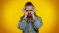 Nosy curious girl closing eyes with hand and spying through fingers, hiding and peeping, seeking Royalty Free Stock Photo