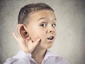 Nosy little boy, man listening carefully to someone's secrets