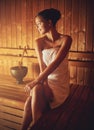 Not a care in the world. a young woman relaxing in the sauna at a spa. Royalty Free Stock Photo