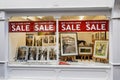 NOT closing down sale sign, following lockdown easing, in picture shop window in Bath, Somerset, UK