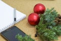 Not completed list of goals in a notebook on a wooden table with Christmas decorations and a laptop Royalty Free Stock Photo